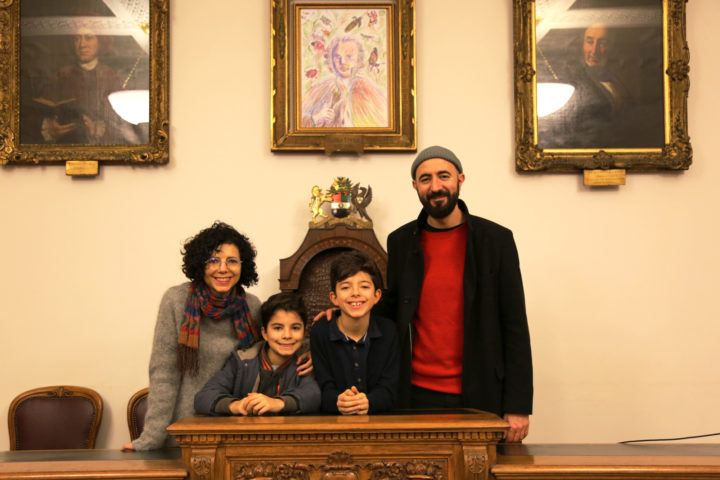 Leo with his family under his portrait of Linnaeus