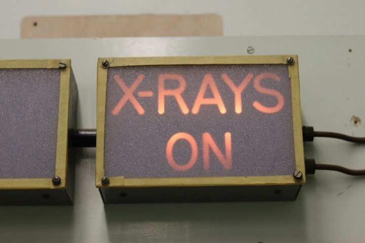 Lit sign saying "X-rays on"