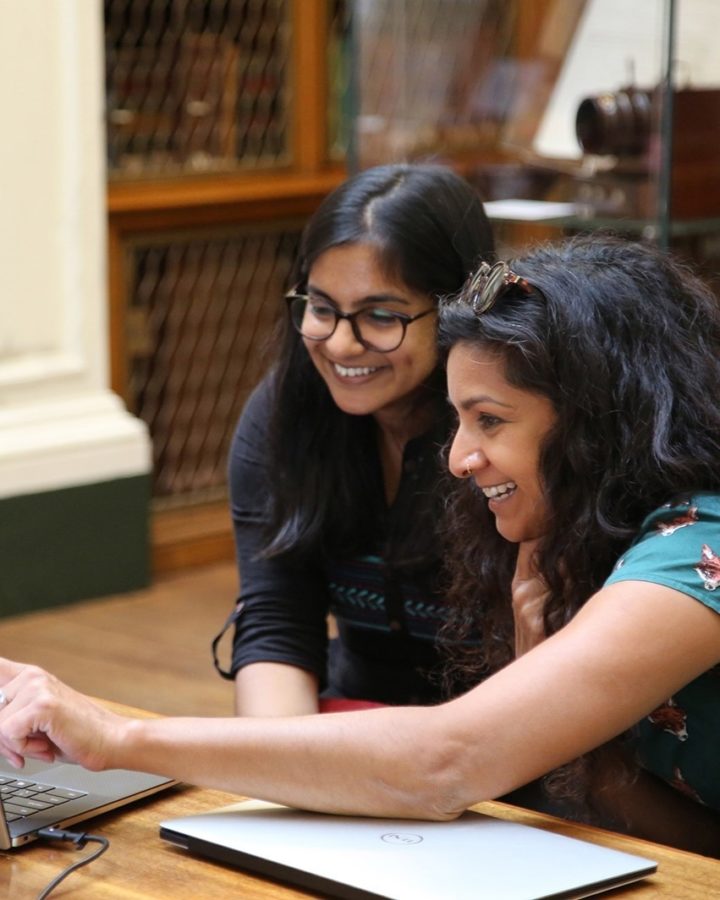 A researcher helping a student