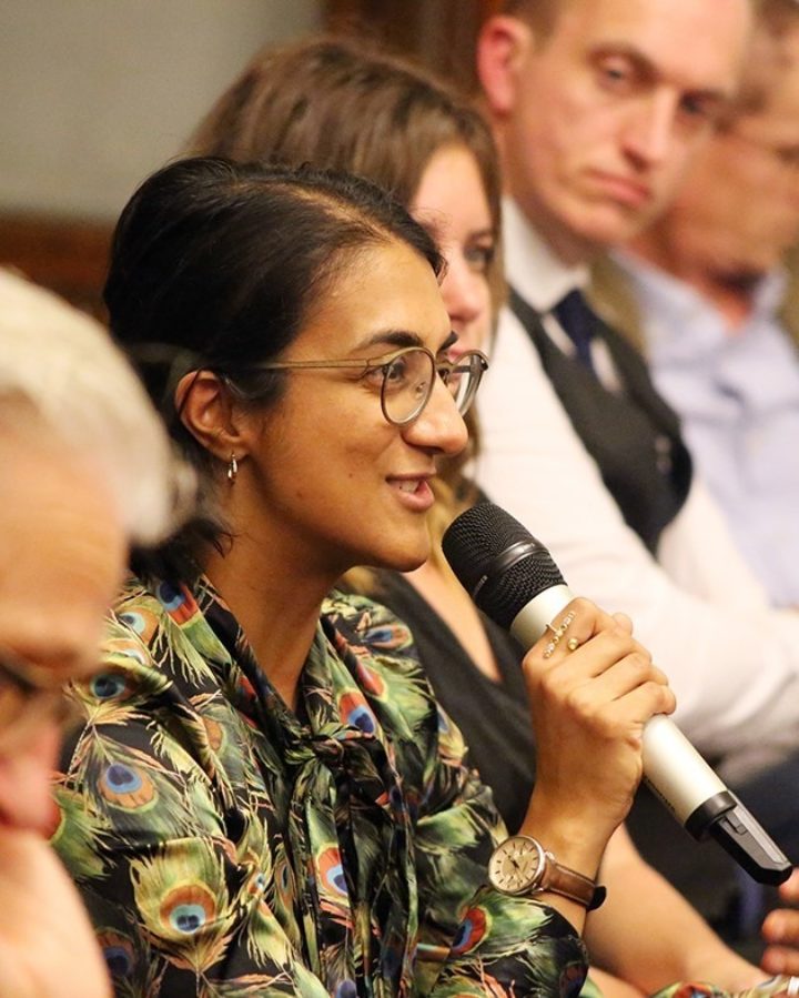 Person speaking into a microphone