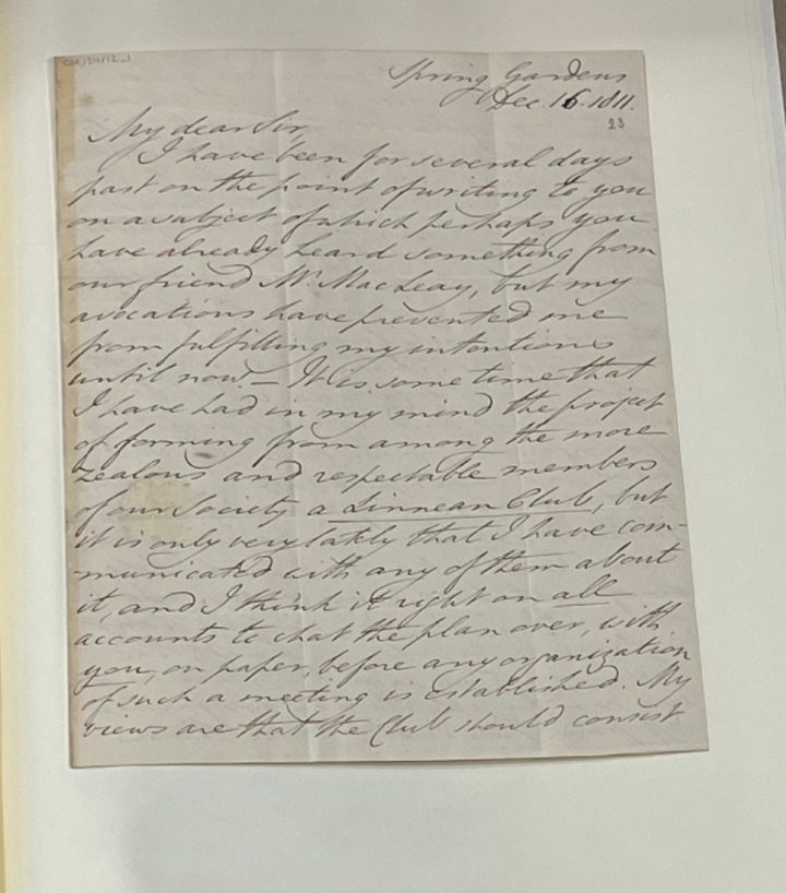 A handwritten letter on a white folder