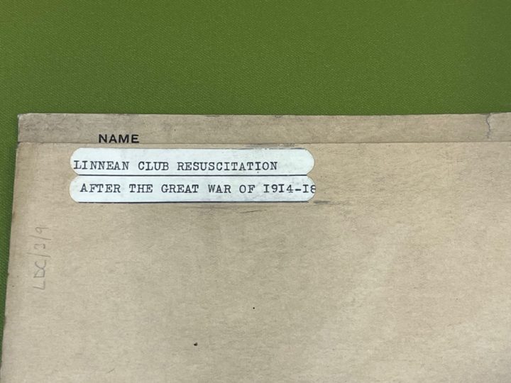 Top left-hand corner of a brown folder with a white label in typescript