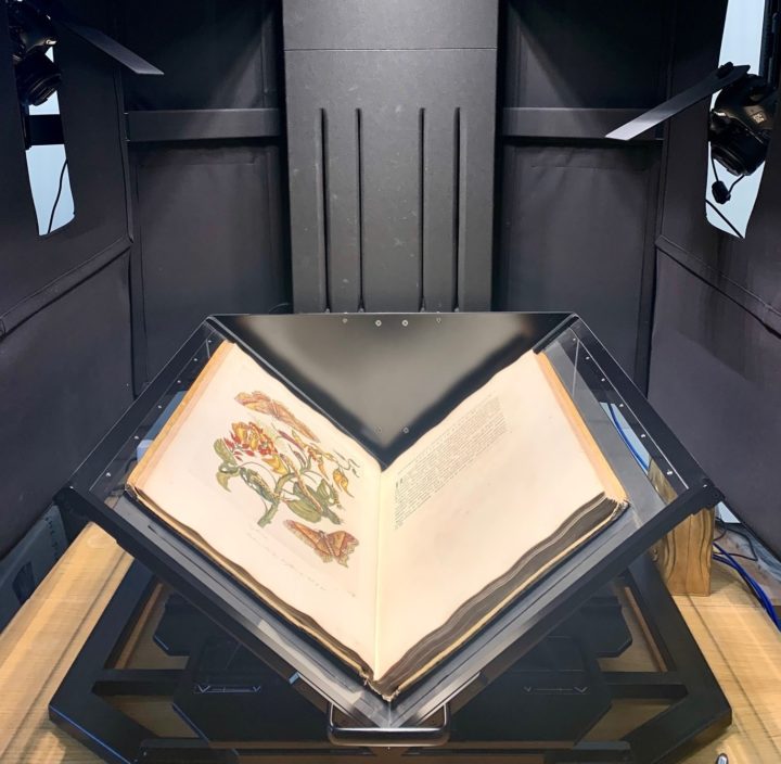 Image of a book cradle scanner with two digital SLR cameras.