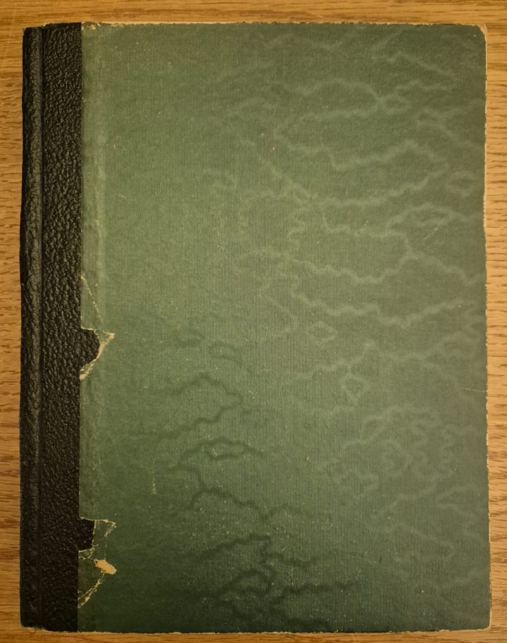 A closed notebook with a green cover