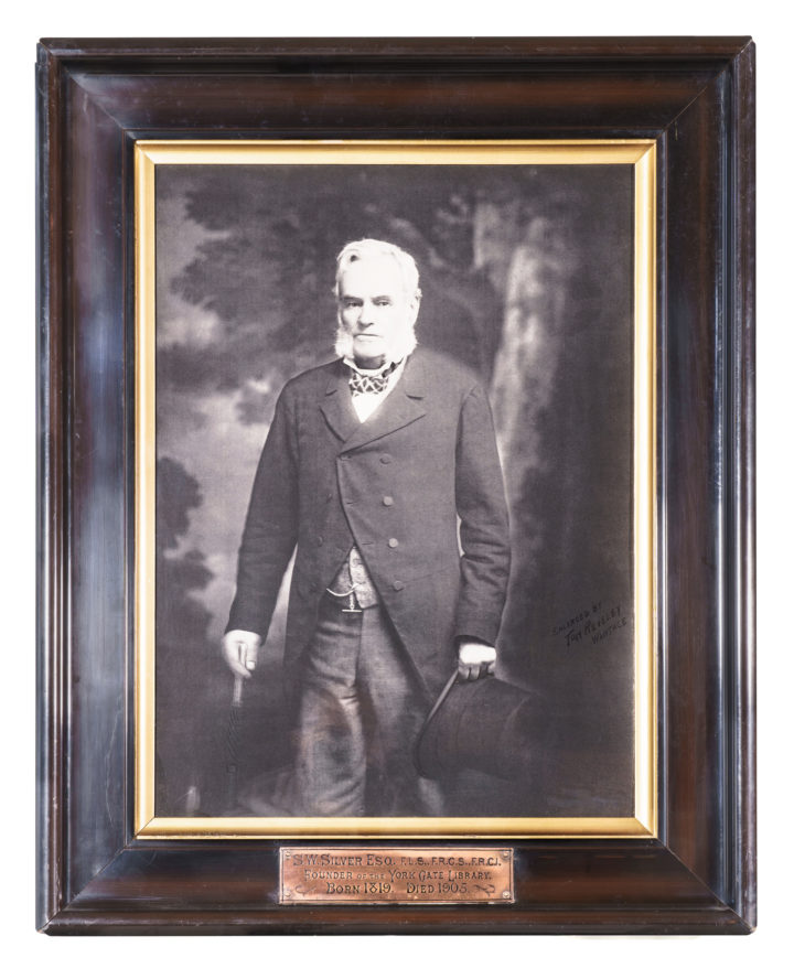 Black and white photograph of S. W. Silver in dark wood frame