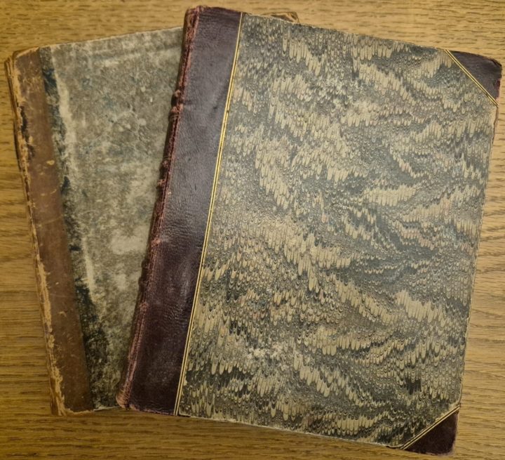 Two books with marbled paper covering