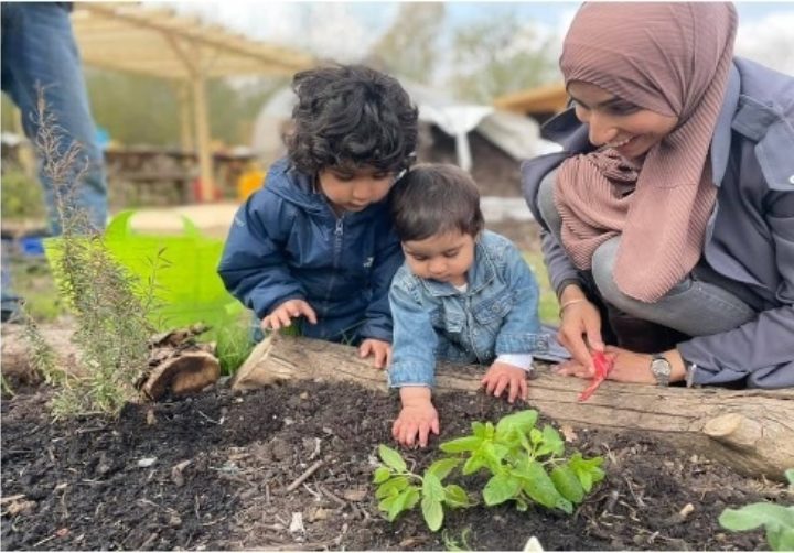 WEST SUFFOLK HIVE IN SUFFOLK, FAMILY STUDYING THE SOIL